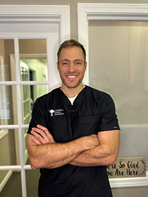 Dr. Robert Gildner wearing a black smock with his arms crossed at Gildner Family Dentistry in Lexington, SC