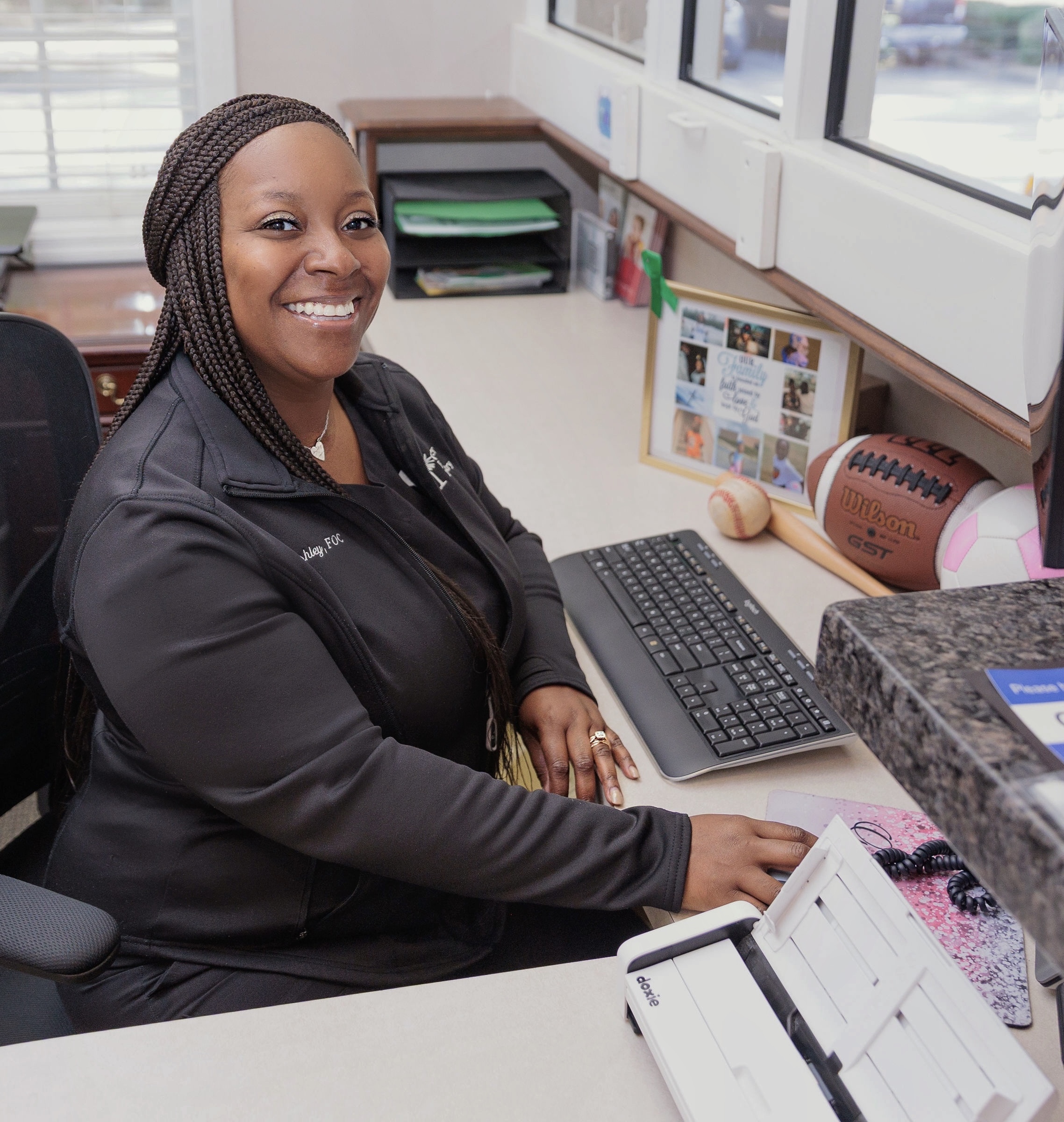 Ashley posing at front desk